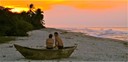 Couple Enjoying Palomino Beach Sunset in a Fishing Canoe